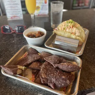 Puffed nachos, chorizo queso, lobster taco