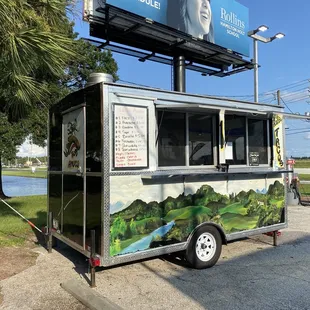 a taco truck parked on the side of the road