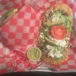 Carne asada huarache and Al pastor gordita.