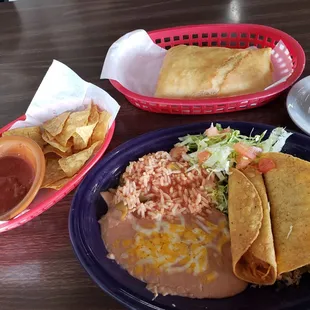 Lunch special taco, taquito, beans, and rice, garnishes and with sopapillo