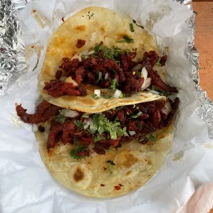 Al pastor tacos on flour. Tortillas are really thin.