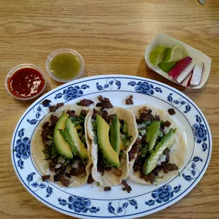 Tacos asada with avocado. Heaven in my mouth! Delicious meat and soft corn tortillas!
