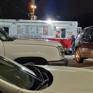 a taco truck parked in a parking lot