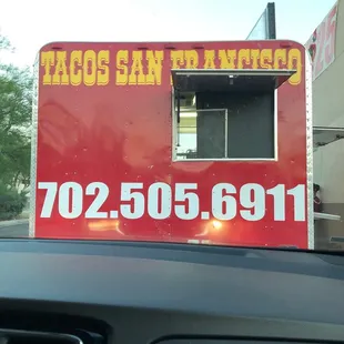 a taco truck in a parking lot