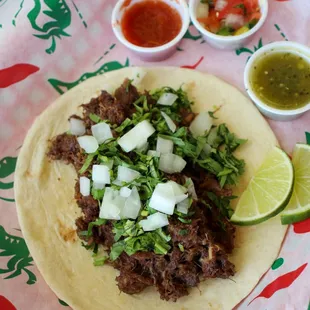 a plate of tacos and salsa