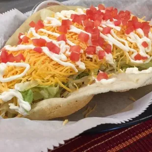 a taco sandwich in a basket