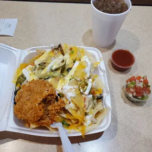 Shredded chicken nachos supreme--fresh condiments--mild sauce for me &amp; salsa Fresca too!