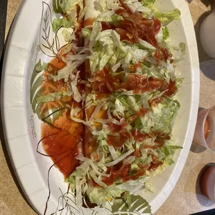 a plate of salad and a drink