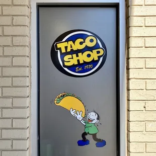 a cartoon character holding a taco