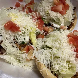 Sopes with your choice of meat and toppings.