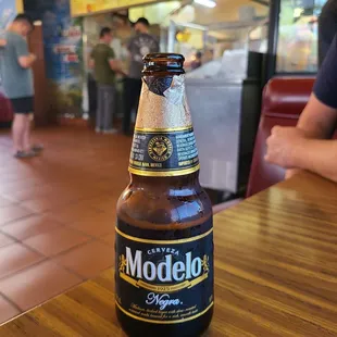 Modelo while we wait for the best bean &amp; cheese burritos &amp; green salsa!
