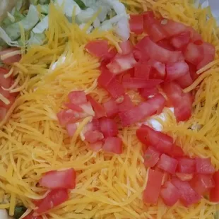 Macho shredded chicken fiesta salad with extra sour cream