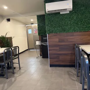 a dining area with tables and chairs