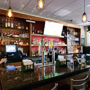 two people sitting at a bar