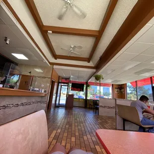 a man sitting at a table in a restaurant