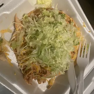 shredded chicken and lettuce in a styrofoam container