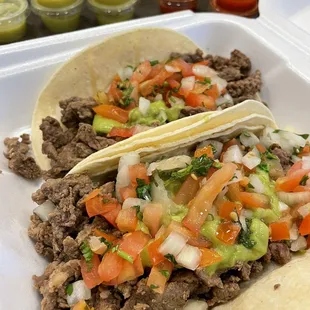 Carne Asada tacos with guacamole on flour tortillas