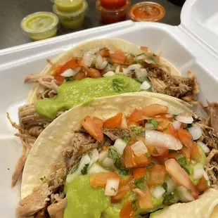 Carnitas Tacos with guacamole on flour tortillas