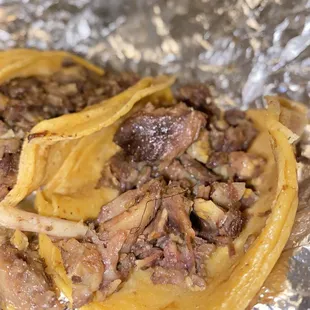 Tacos de Cabeza featuring a thick strand of hair