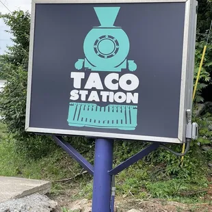 taco station sign on a pole