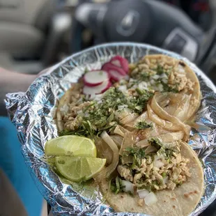 a person holding a plate of food