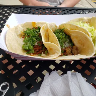 Left to right - barbacoa, steak, and chicken tacos
