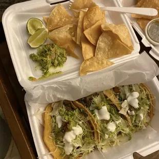 Steak Taco and chicken taco with queso fresco, sour cream, lettuce, salsa, and guacamole  Guacamole &amp; Chips