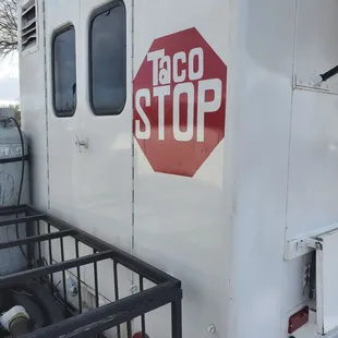 a taco stop sign on the side of a truck