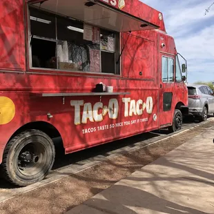 a taco truck parked on the side of the road