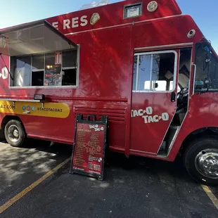 a taco truck parked in a parking lot