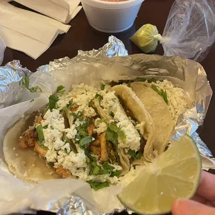 a person holding a lime wedge