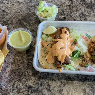 My go-to. One fish taco and one street taco. Went with campechano this time. And the star of the show..their avocado salsa!