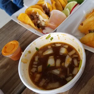 a bowl of hot sauce and a bowl of chili