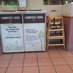 a counter with a sign that says compost here