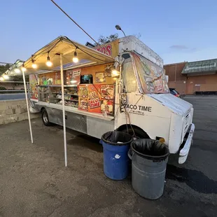 a taco truck parked in a parking lot