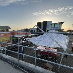 a tent set up in a parking lot