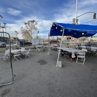 tables and chairs in a parking lot