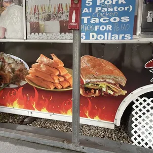 a taco truck with a menu on it