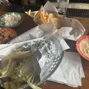 Side of Beans Queso Dip and Chips Steak with Rice Taco