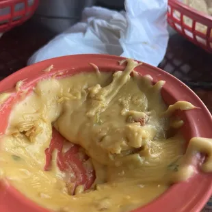 Disgusting queso so thick and hard it sticks to the dish like cement
