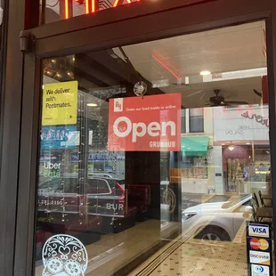 a mexican restaurant with a neon sign