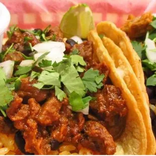 a plate of tacos and a bowl of salsa