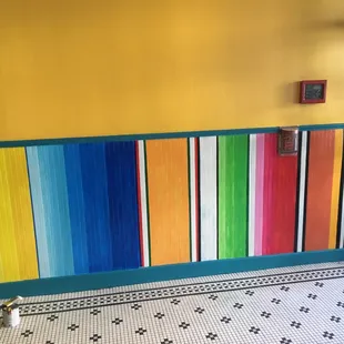 a colorful wall in a restaurant
