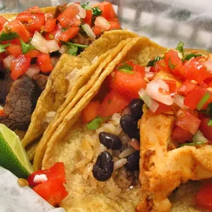 Chicken &amp; Carne Asada Tacos! Corn tortilla &amp; your choice of meat, cilantro &amp; onions or pico de gallo. Served with rice &amp; beans.