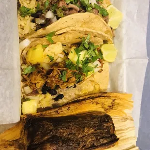 Mole tamal, al pastor taco and lengua taco