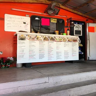 a food stand with menus on it