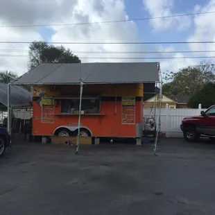 a taco truck parked in a parking lot