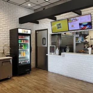 a bar with a large screen tv