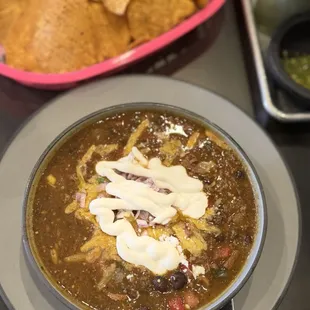 Brisket Green Chili topped with onions, cheese and sour cream