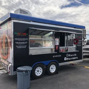a taco truck parked in a parking lot